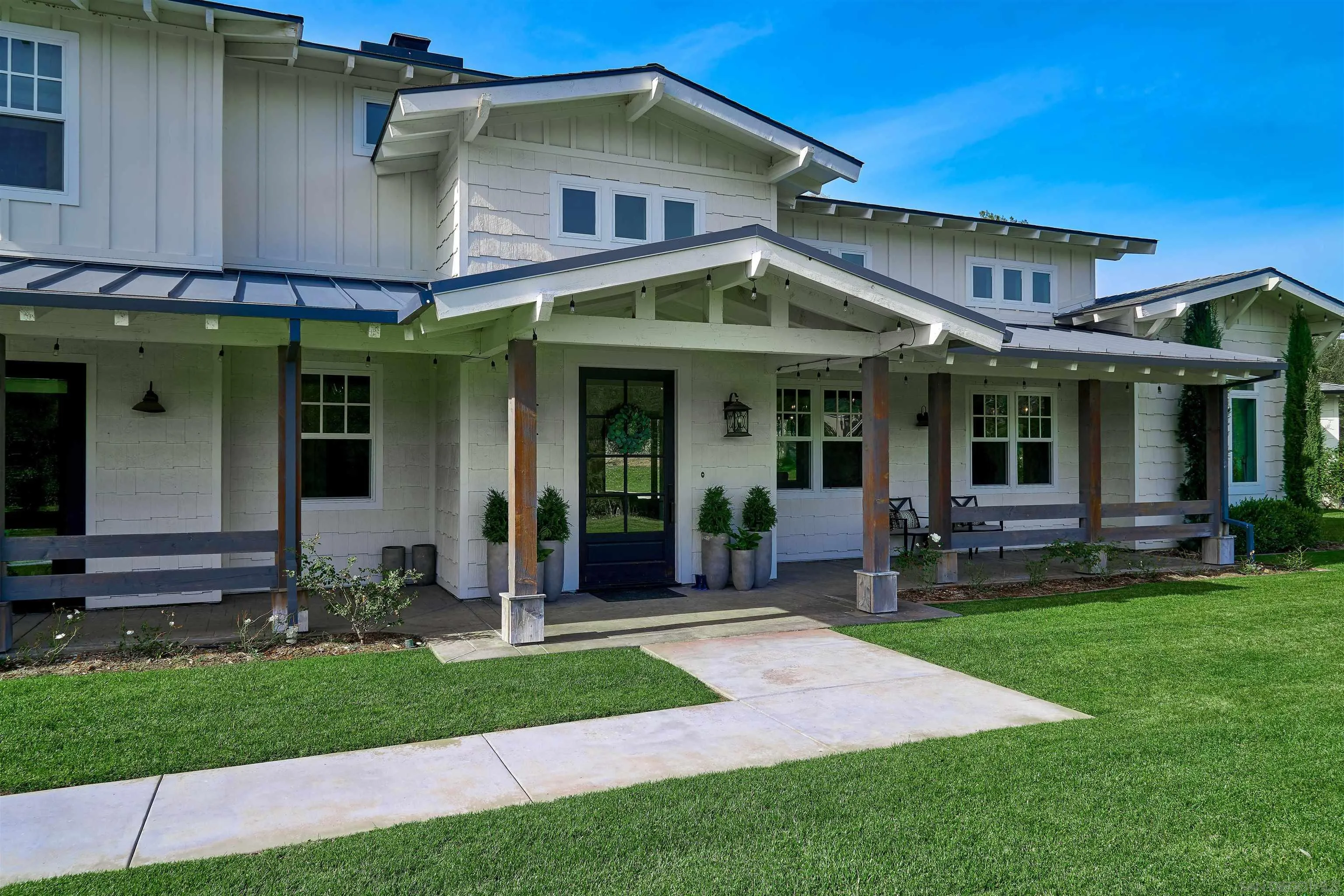 20104 Questhaven Road Elfin Forest, CA 92029 - Photo 33 of 33 a front view of a house with a yard and porch