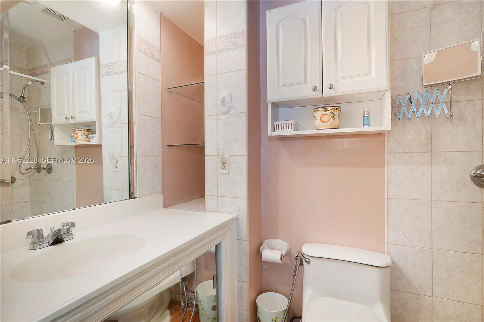 3030 Southwest 57th Avenue Miami, FL 33155 - Photo 11 of 12 a bathroom with a sink toilet and shower