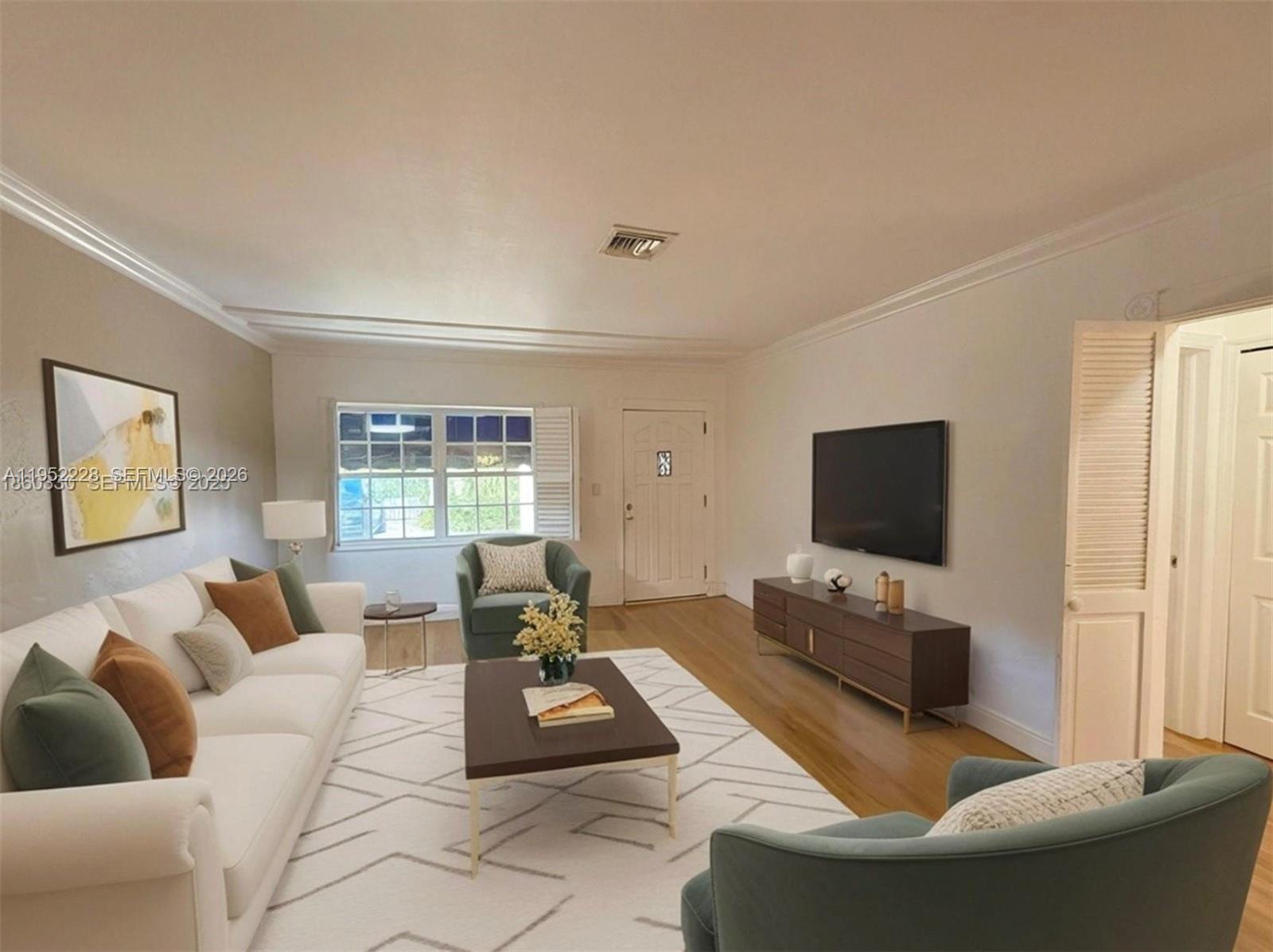 3030 Southwest 57th Avenue Miami, FL 33155 - Photo 4 of 12 a living room with furniture and a flat screen tv