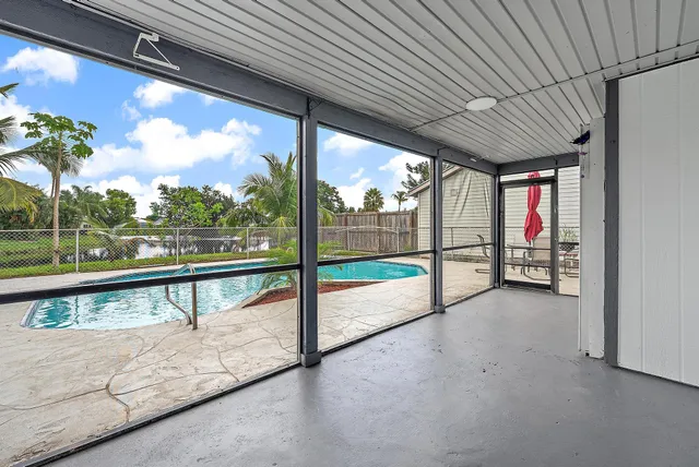 a view of a swimming pool with a lounge chairs