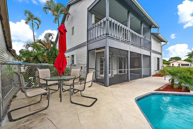 a view of a swimming pool with a lounge chairs