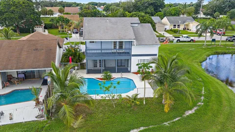 an aerial view of a house with a garden