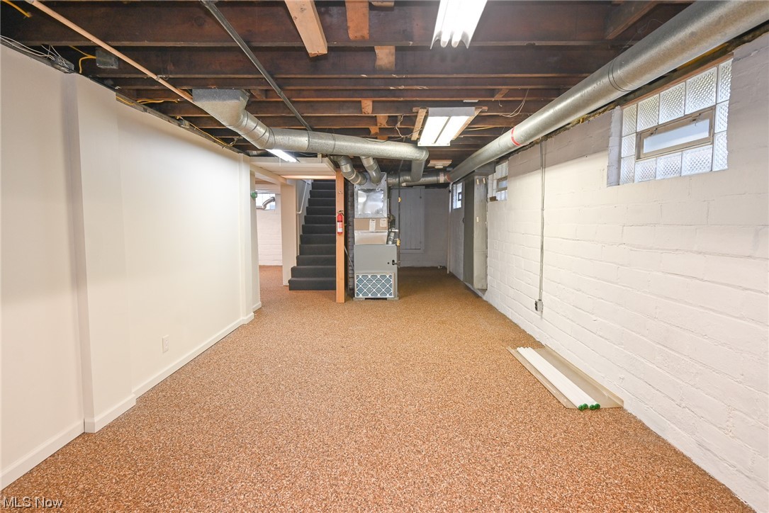 3832 Silsby Road Cleveland, OH 44111 - Photo 17 of 21 Basement featuring light colored carpet and heating utilities