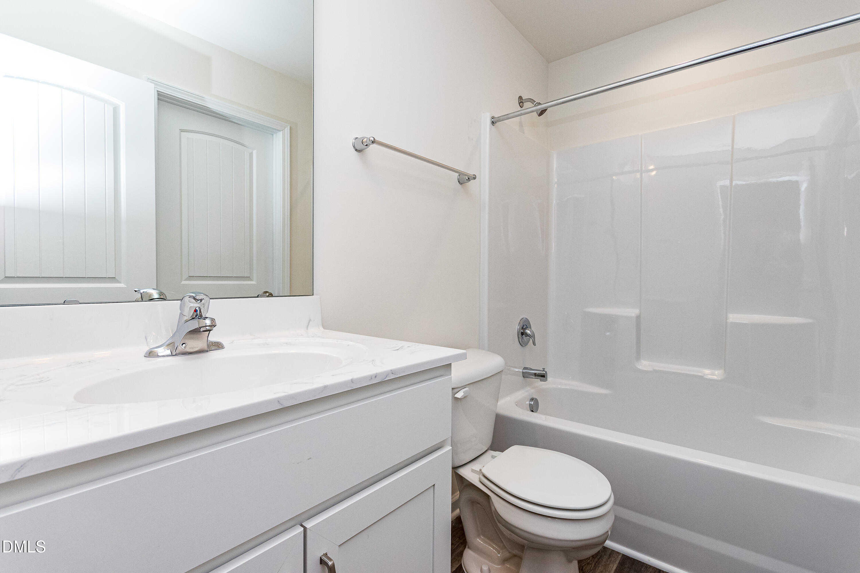 3309 Slippery Elm Drive Raleigh, NC 27610 - Photo 14 of 29 a bathroom with a sink a toilet and a bathtub