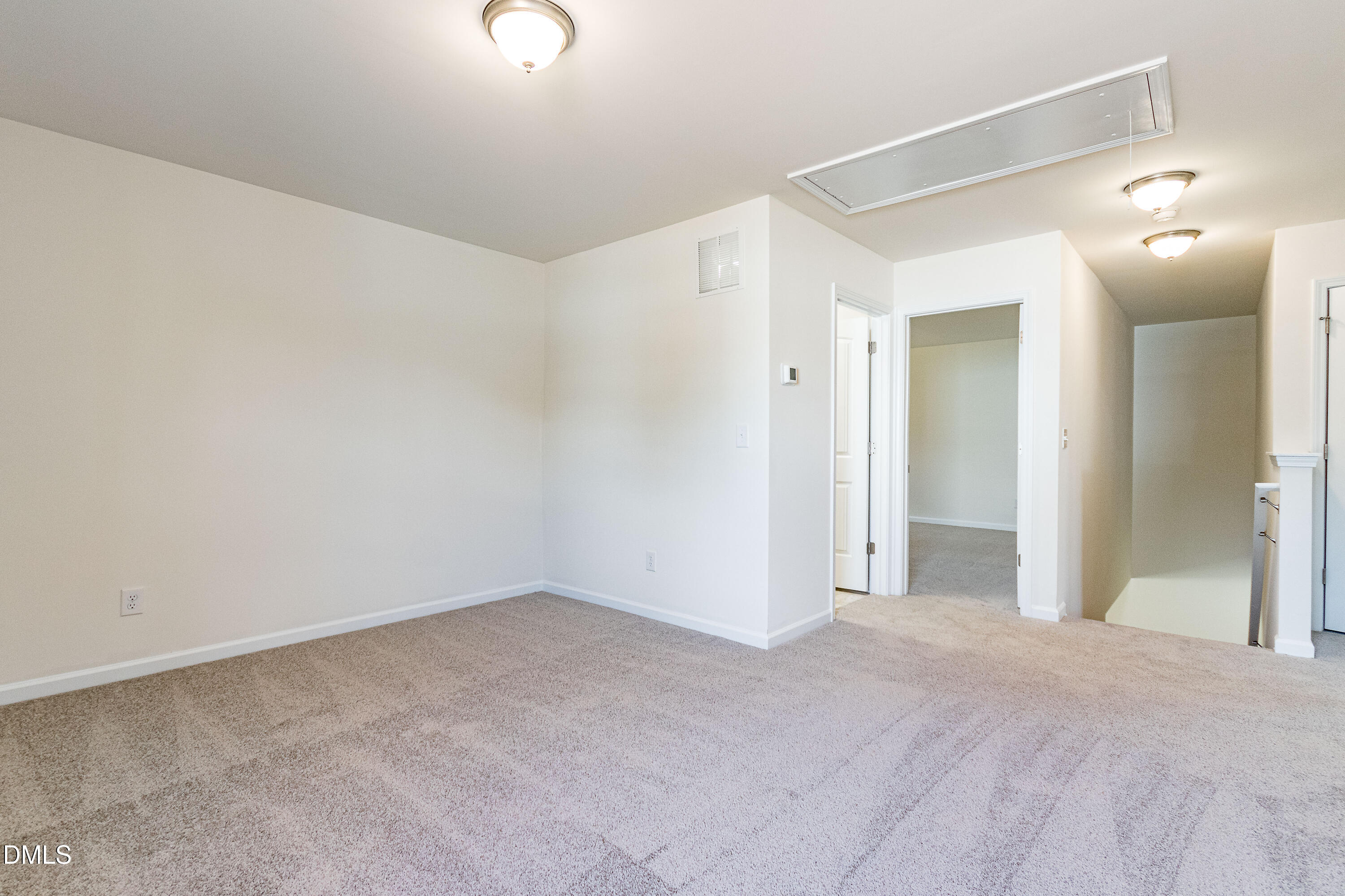3309 Slippery Elm Drive Raleigh, NC 27610 - Photo 19 of 29 a view of a big room with wooden floor and windows