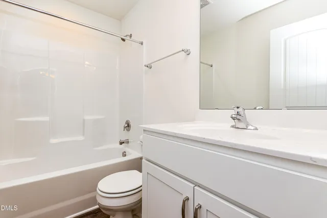 a bathroom with a sink a toilet and a bathtub