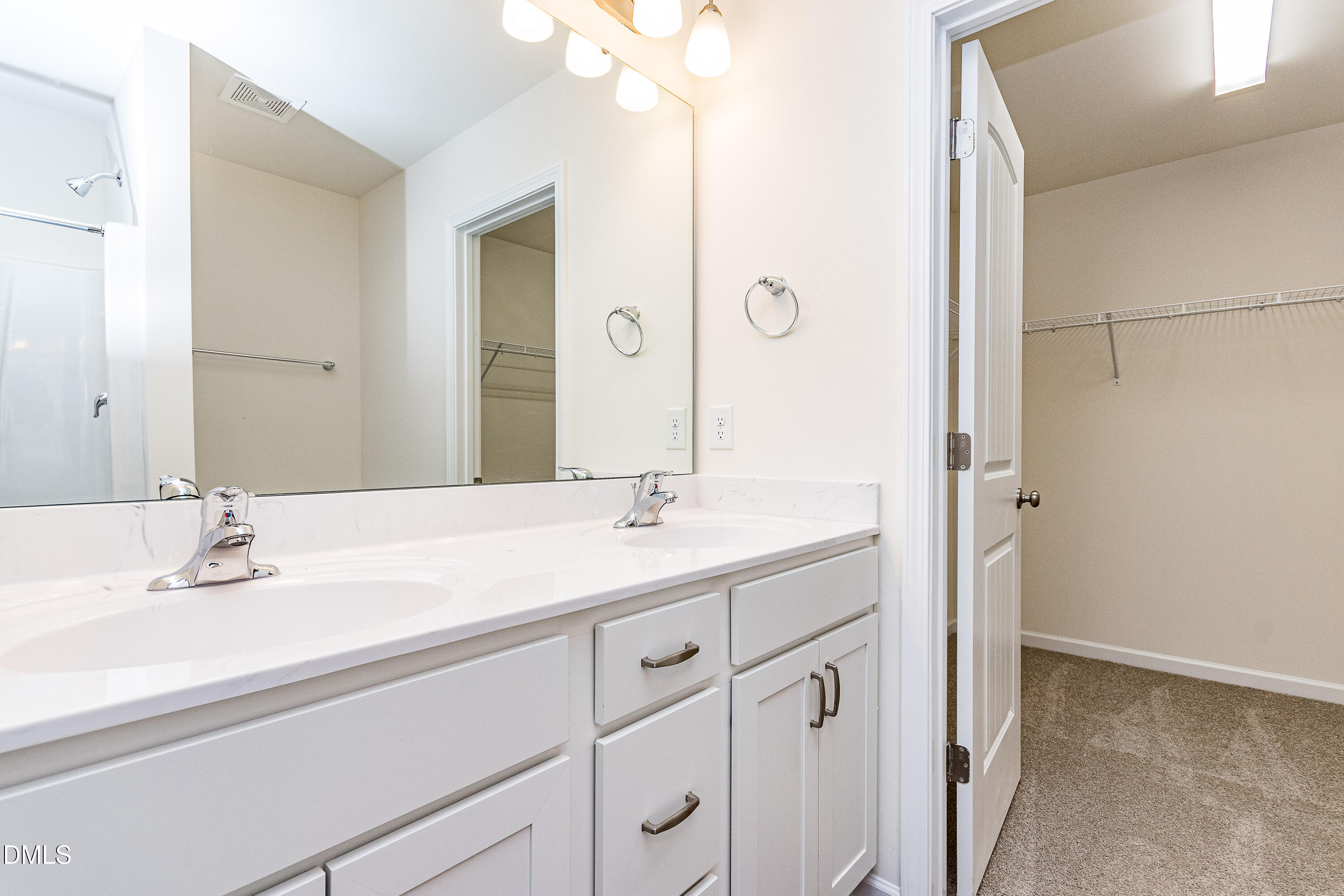 3309 Slippery Elm Drive Raleigh, NC 27610 - Photo 26 of 29 a bathroom with a sink and a mirror
