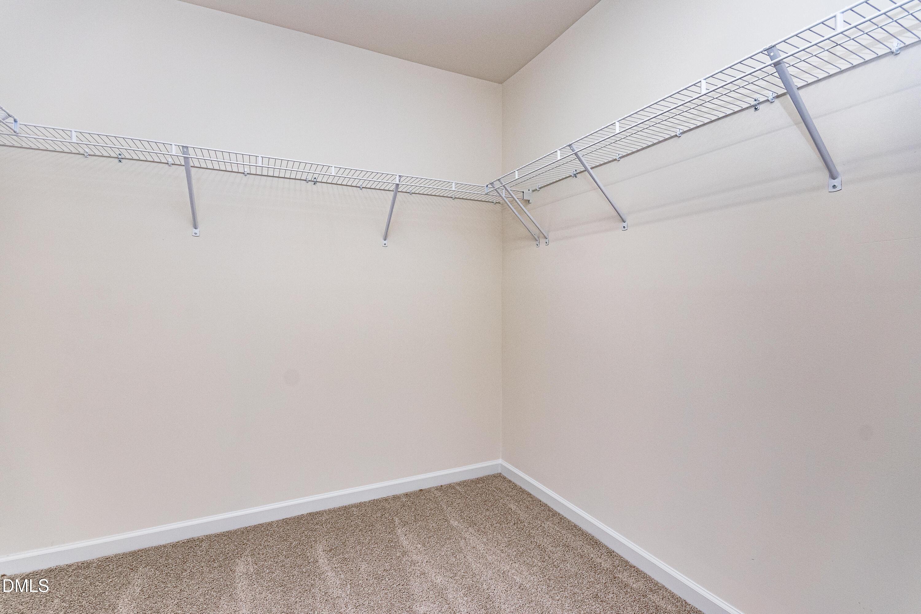 3309 Slippery Elm Drive Raleigh, NC 27610 - Photo 28 of 29 a view of a room with racks on the wall