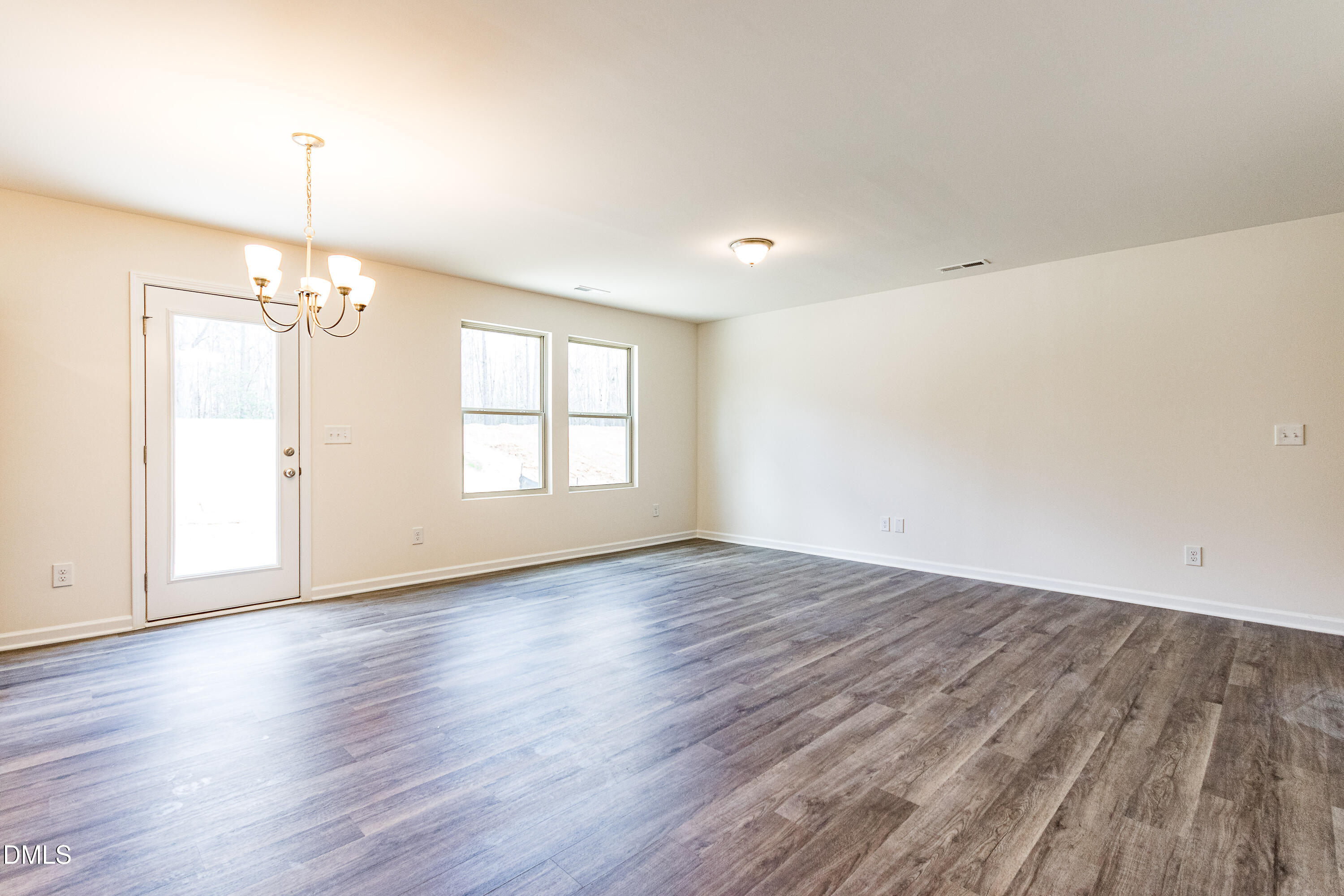 3309 Slippery Elm Drive Raleigh, NC 27610 - Photo 3 of 29 a view of livingroom with hardwood floor and window