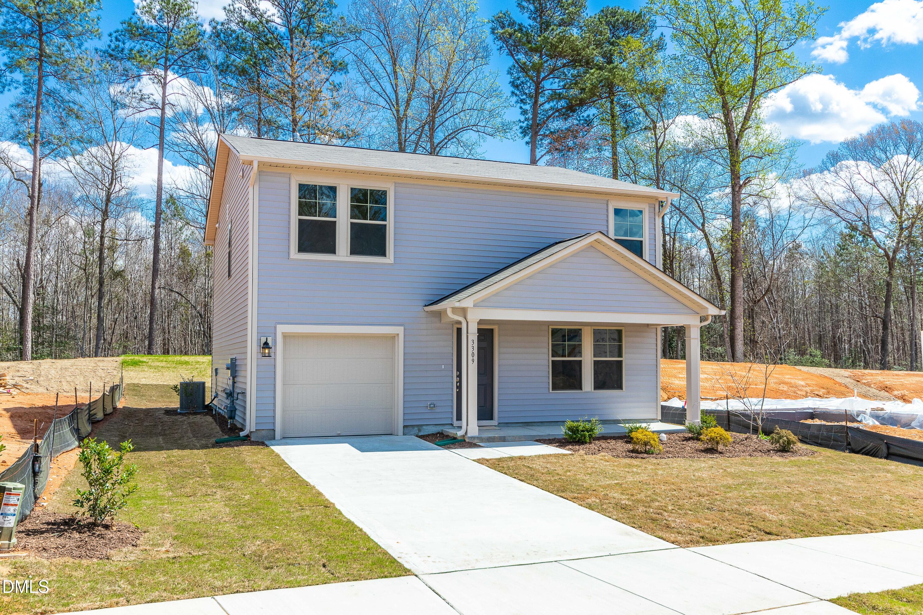 3309 Slippery Elm Drive Raleigh, NC 27610 - Photo 4 of 29 a view of backyard of house with outdoor seating