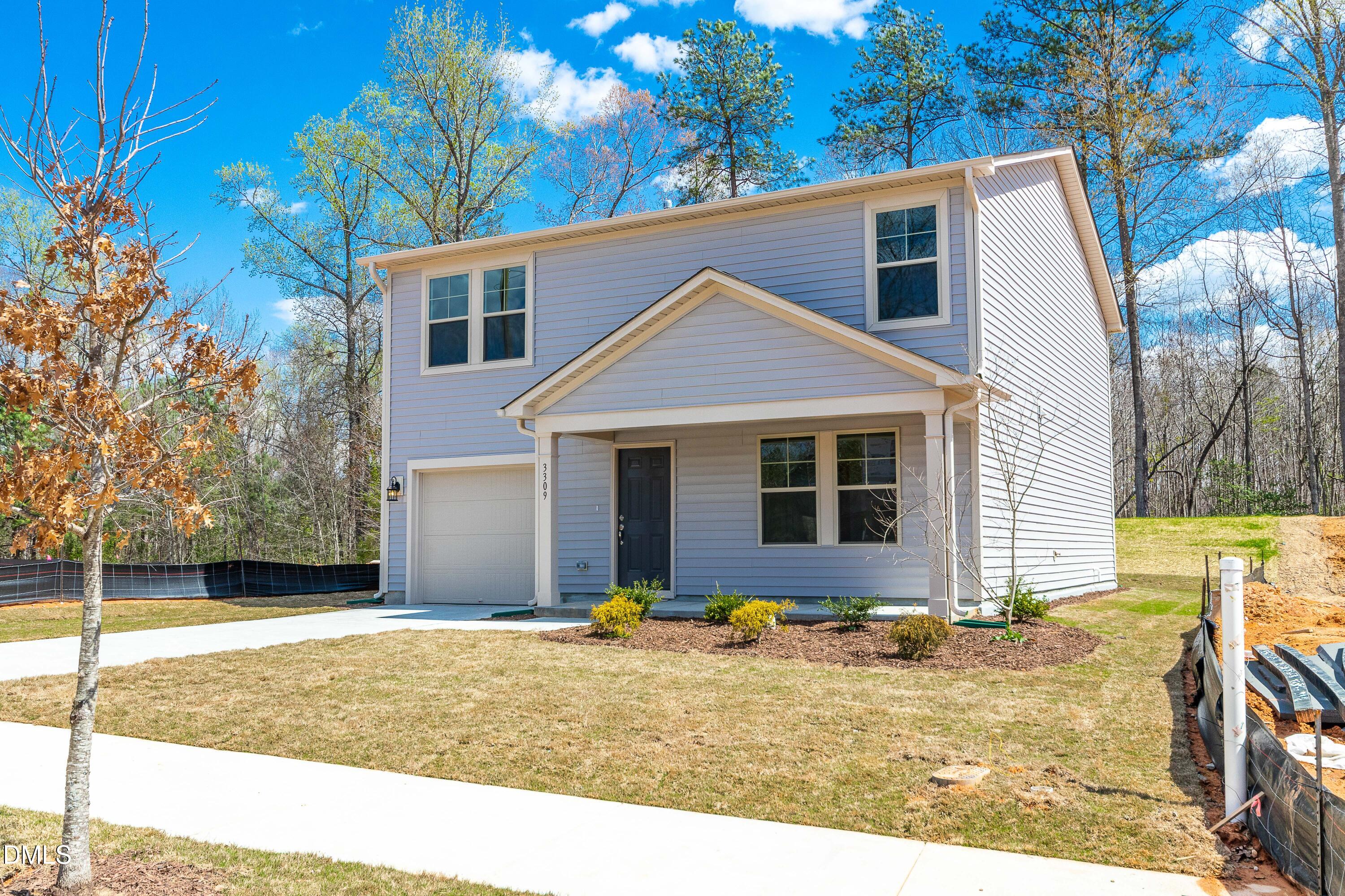 3309 Slippery Elm Drive Raleigh, NC 27610 - Photo 5 of 29 a view of a house with backyard and sitting area