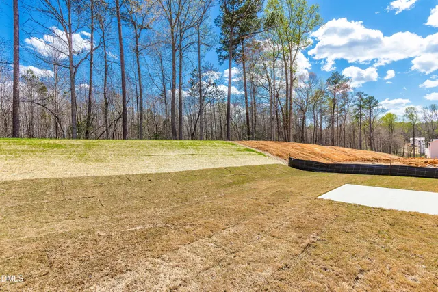 a view of a swimming pool with an outdoor space and seating area