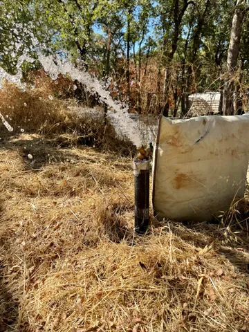 a view of a backyard of the house