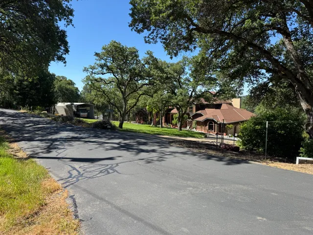 a view of a street with houses on the side