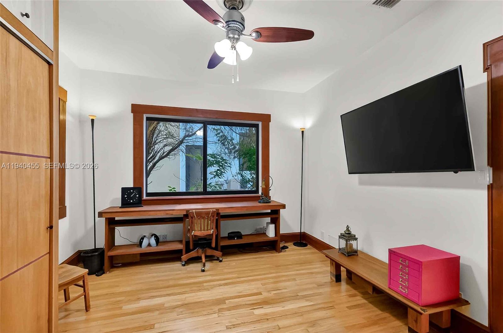 452 Southwest 21st Road Miami, FL 33129 - Photo 22 of 51 a living room with furniture and a flat screen tv