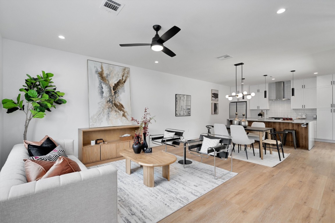 5603 Manor Road, Unit A Austin, TX 78723 - Photo 1 of 1 a living room with furniture and a chandelier