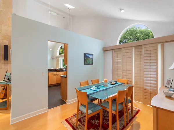 a dining room with furniture and window