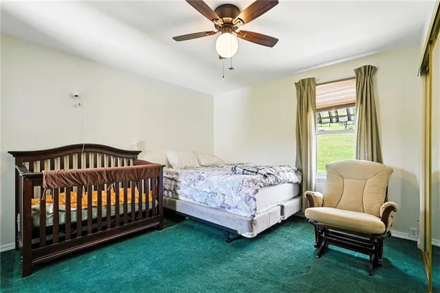 a bedroom with a bed and a couch