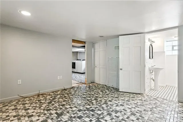 a bedroom with a bed and a walk in closet