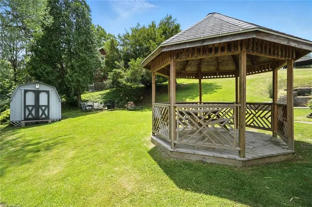 a yellow house with a yard in front of it