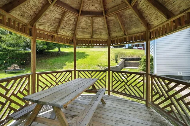 a view of a balcony with wooden floor