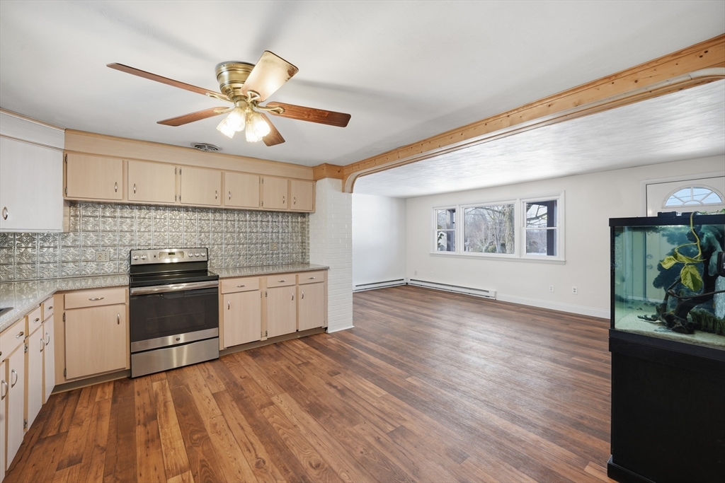 325 Granby Road Chicopee, MA 01013 - Photo 12 of 36 a kitchen with stainless steel appliances granite countertop a stove and a refrigerator