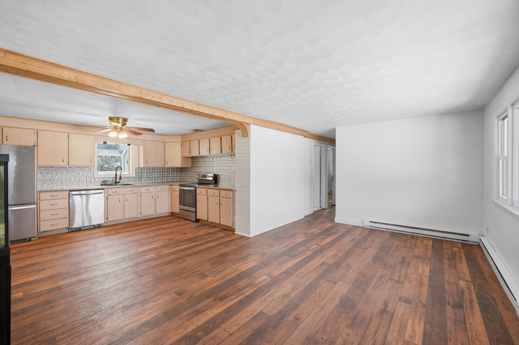 325 Granby Road Chicopee, MA 01013 - Photo 13 of 36 a view of kitchen with wooden floor