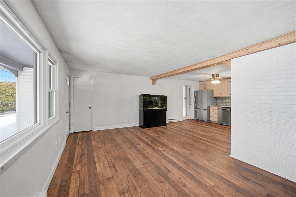 325 Granby Road Chicopee, MA 01013 - Photo 15 of 36 a view of a livingroom with a kitchen and a window