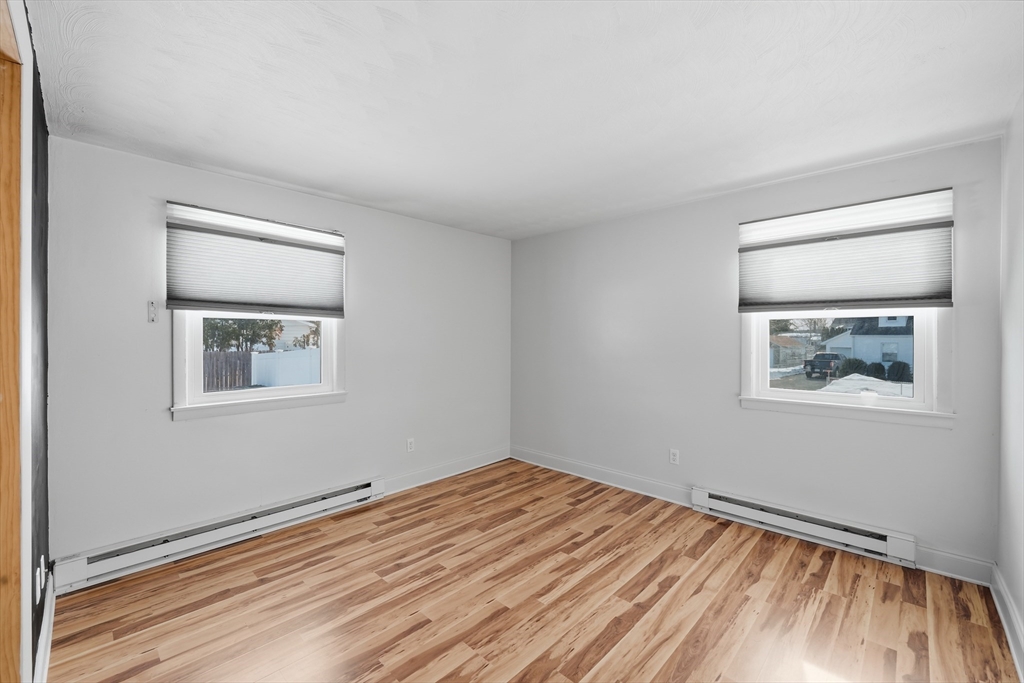 325 Granby Road Chicopee, MA 01013 - Photo 19 of 36 a view of an empty room with wooden floor and a window