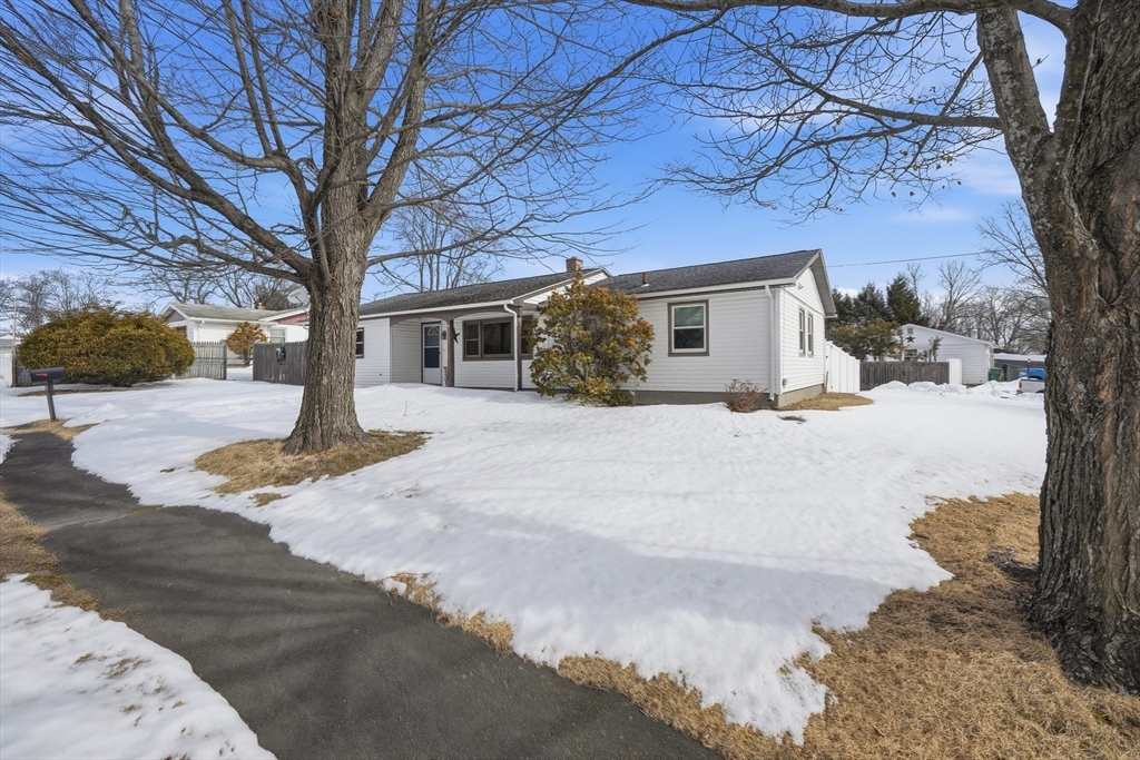 325 Granby Road Chicopee, MA 01013 - Photo 2 of 36 a view of a house with a yard covered in snow