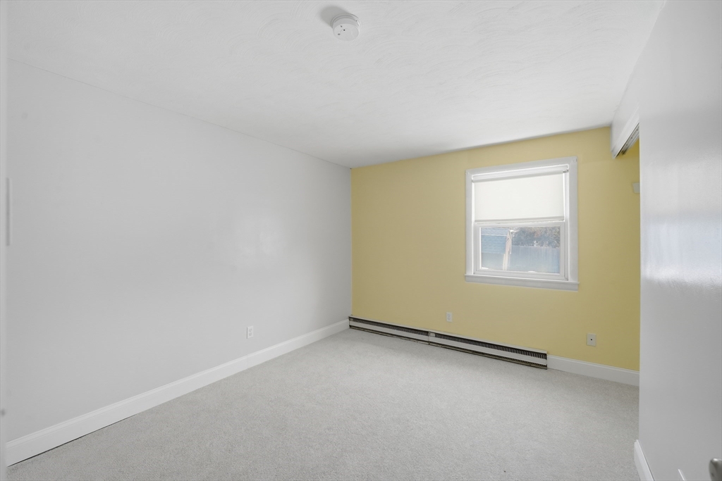 325 Granby Road Chicopee, MA 01013 - Photo 22 of 36 an empty room with a window