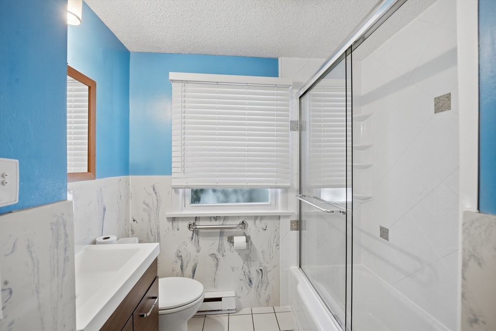 325 Granby Road Chicopee, MA 01013 - Photo 26 of 36 a bathroom with a sink a toilet and shower
