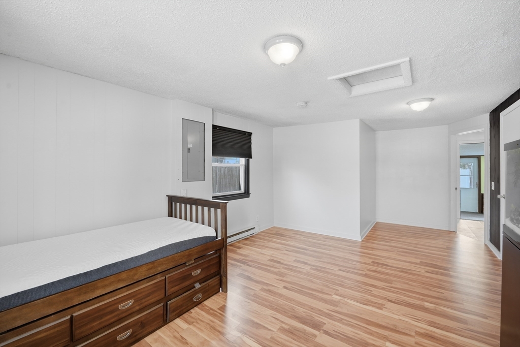 325 Granby Road Chicopee, MA 01013 - Photo 27 of 36 a bedroom with a bed and a dresser