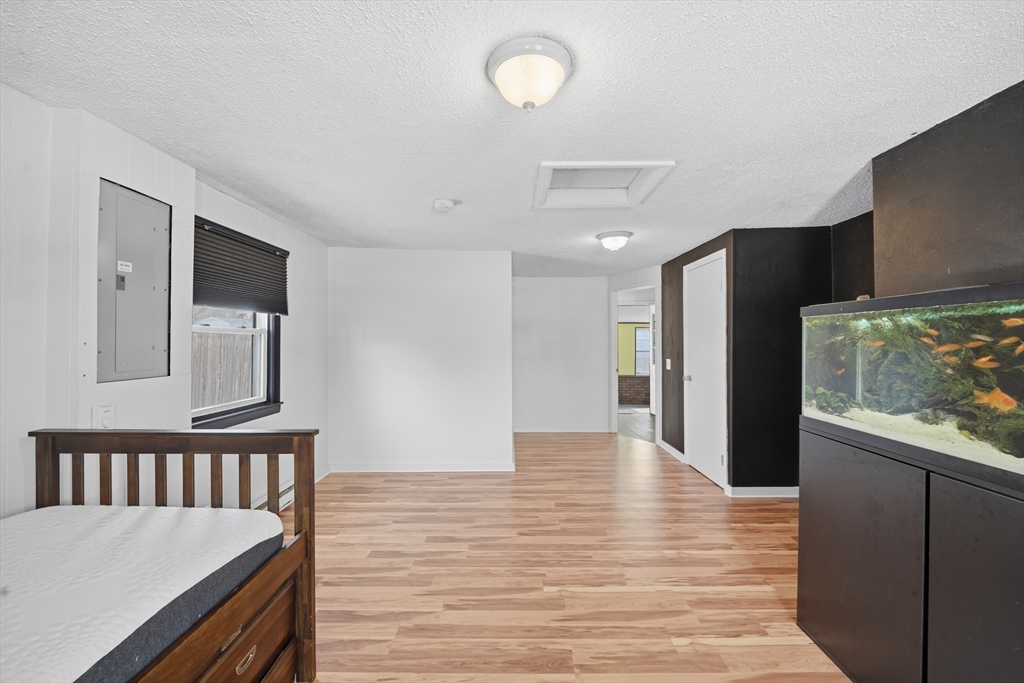 325 Granby Road Chicopee, MA 01013 - Photo 28 of 36 a view of a hallway with wooden floor and staircase