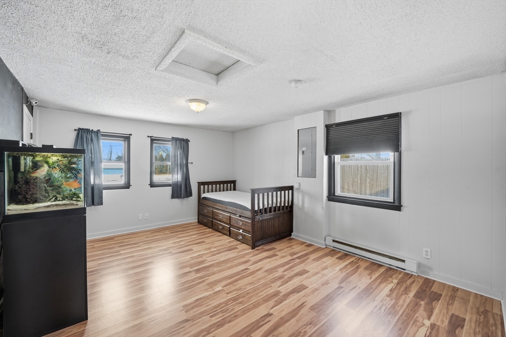 325 Granby Road Chicopee, MA 01013 - Photo 30 of 36 a living room with wooden floor and large window