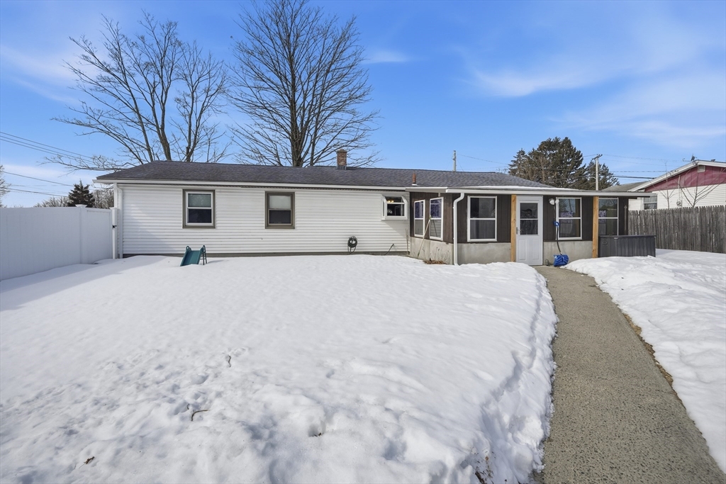 325 Granby Road Chicopee, MA 01013 - Photo 3 of 36 a view of a white house with a yard and large trees