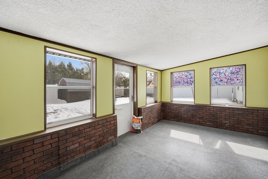 325 Granby Road Chicopee, MA 01013 - Photo 32 of 36 a view of an empty room with wooden floor and a window
