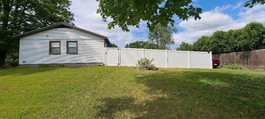 325 Granby Road Chicopee, MA 01013 - Photo 6 of 36 a front view of house with backyard and green space
