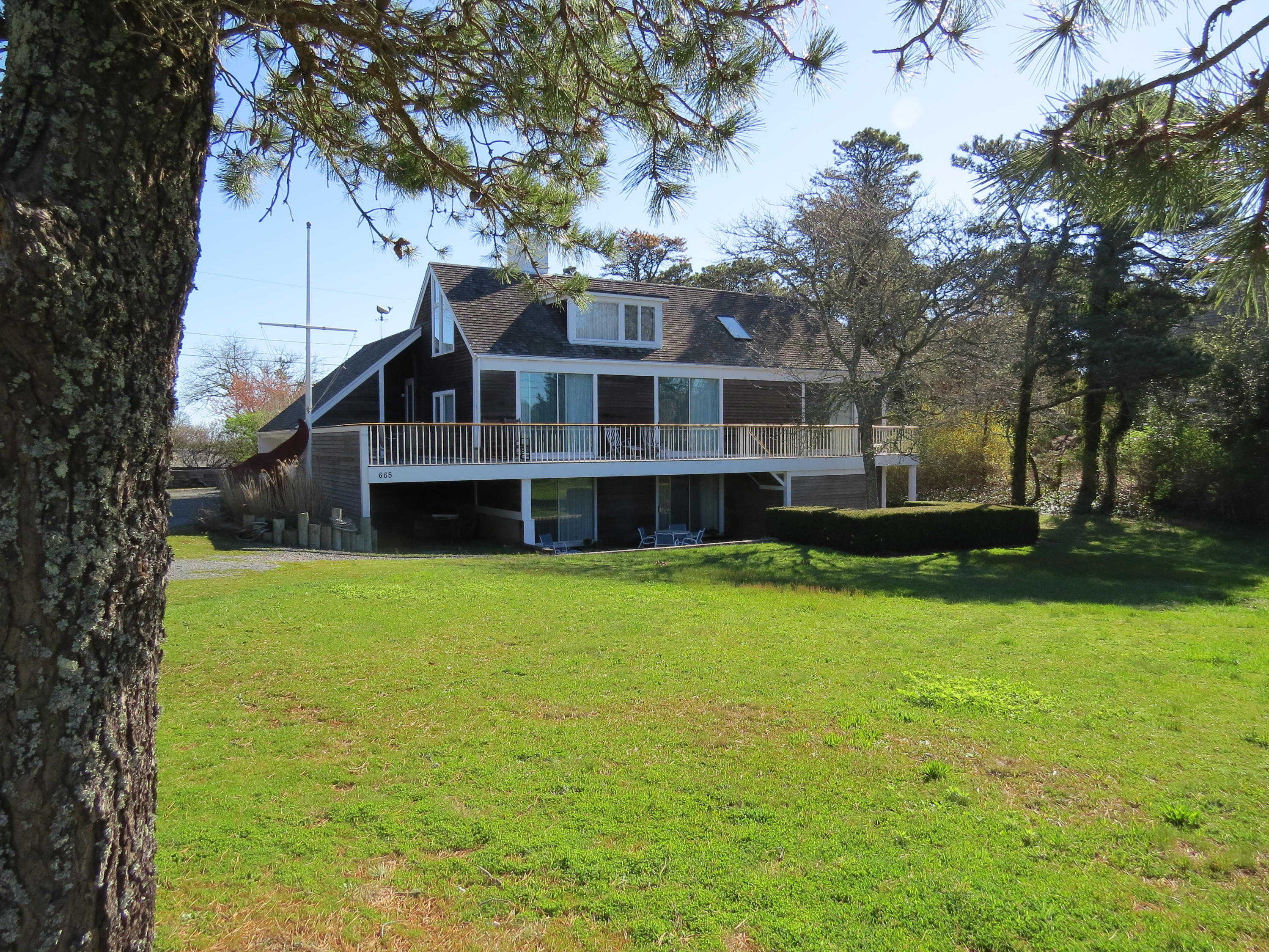 665 Fox Hill Road Chatham, MA 02633 - Photo 1 of 31 a front view of a house with a garden