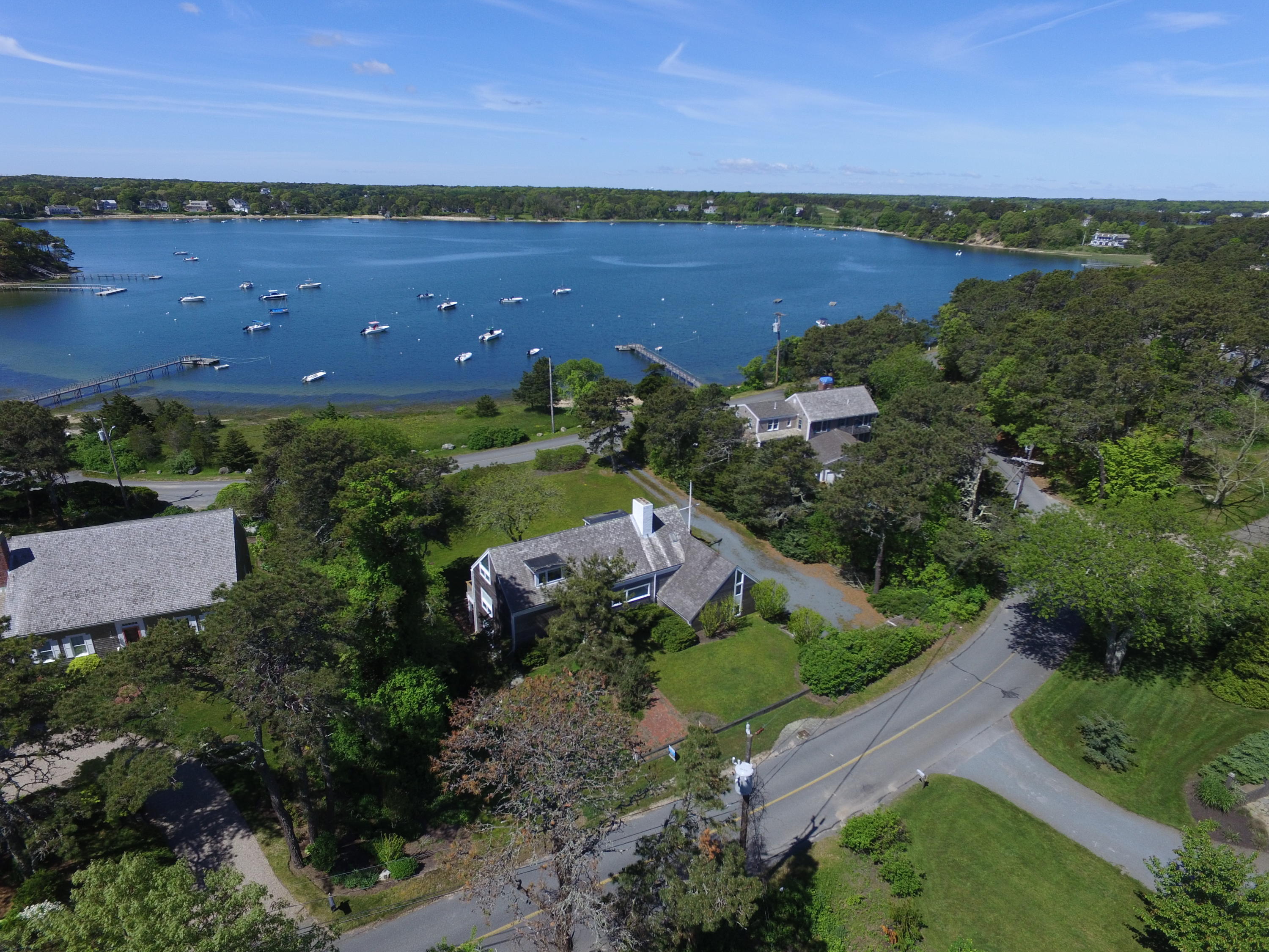 665 Fox Hill Road Chatham, MA 02633 - Photo 8 of 31 an aerial view of a house with a garden and lake view