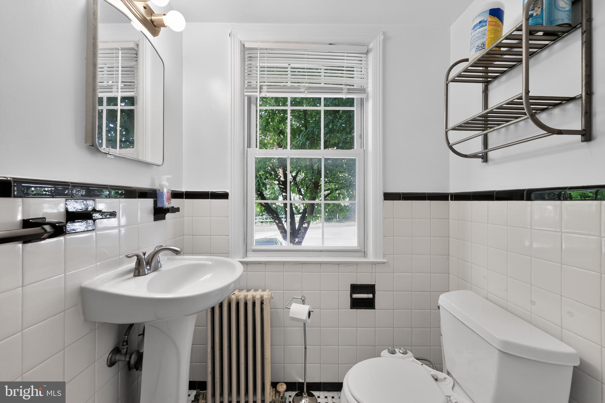 8329 Grubb Road, Unit G103 Silver Spring, MD 20910 - Photo 13 of 24 Bright and airy bathroom retreat.