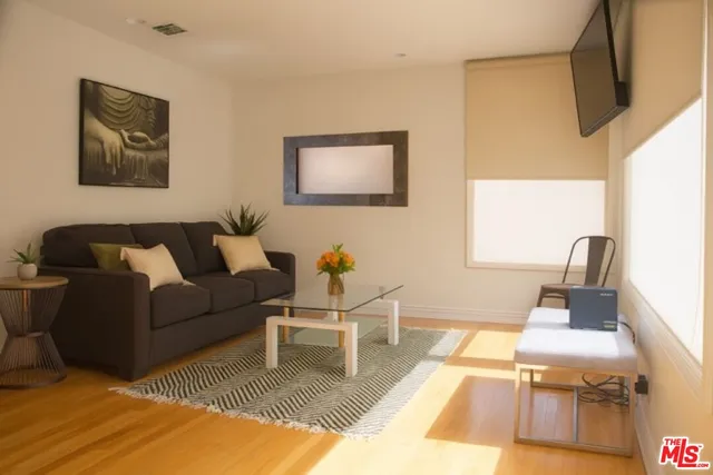 a living room with furniture and a table