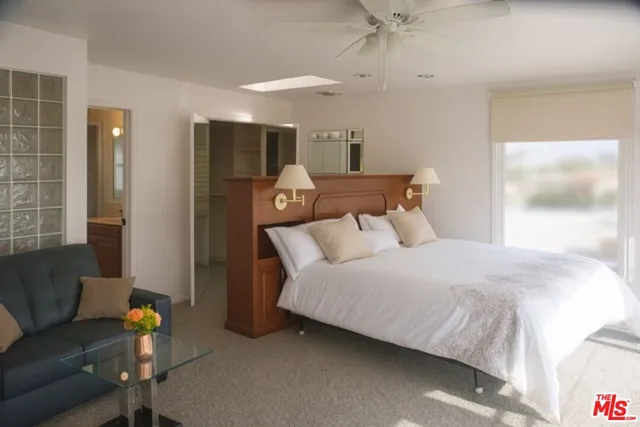 a bed room with a bed and a couch