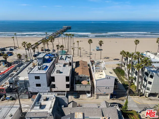 an aerial view of a building with garden