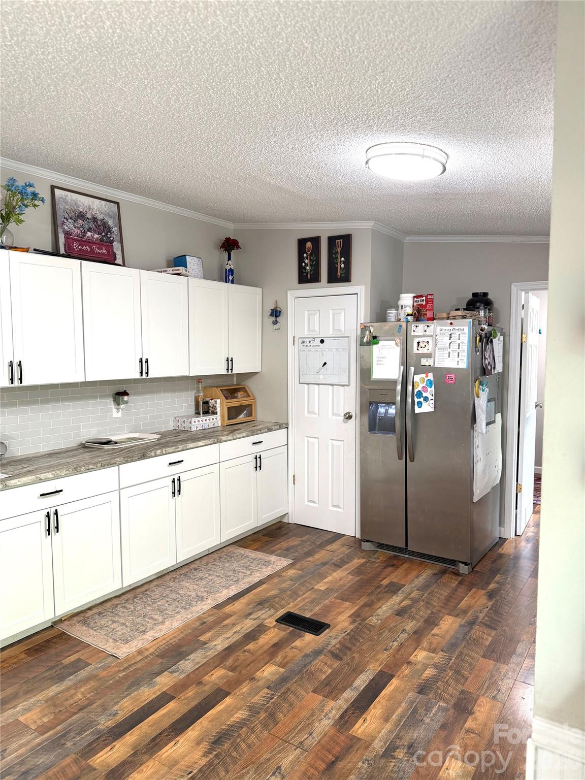 929 Brookhaven Road Statesville, NC 28625 - Photo 13 of 36 a kitchen with stainless steel appliances granite countertop a refrigerator and a sink