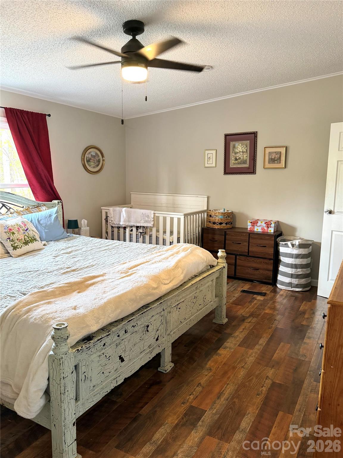 929 Brookhaven Road Statesville, NC 28625 - Photo 16 of 36 a bedroom with a bed and a chandelier
