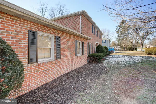 a bathroom with a sink toilet and mirror