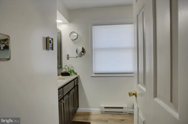 a kitchen with kitchen island granite countertop a stove sink microwave and refrigerator