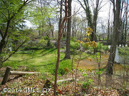 198 A Valley Road Cos Cob, CT 06807 - Photo 4 of 7 a backyard of a house with a yard and outdoor seating