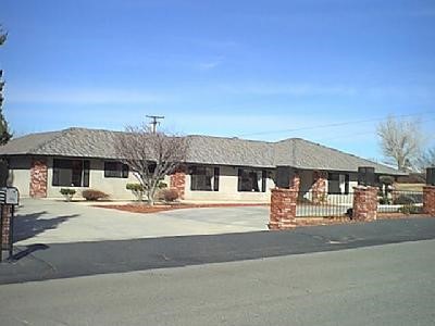 16066 Rimrock Road Apple Valley, CA 92307 - Photo 1 of 1 front view of a house with a street view